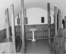 Interior view of the Blockhouse, showing the powder magazine with thick arched ceilings arched with brick, 1991.; Parks Canada Agency / Agence Parcs Canada, 1991.