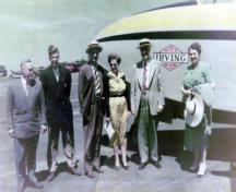 Left to right: Captain Jimmy Wade, Jack Irving, Mr. and Mrs. Frank J. Lang, manager of the Irving Pulp Mill, K.C. and Mrs. Irving.; Wade #11400, Heritage Resources, Saint John