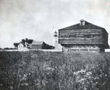 Historic image of the blockhouse, including the buildings that once stood near the lighthouse.; Parks Canada Agency / Agence Parcs Canada