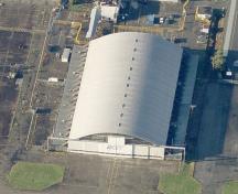Arial view of the BCIT Hangar, Building T-131, showing its well-balanced massing, with a large, vaulted aircraft bay flanked on both sides by symmetrical one-storey administrative blocks, 2011.; Microsoft Bing Maps, 2011.