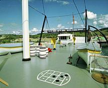 General view of the S.S. Klondike showing the surviving unity of its equipment, in particular its original surface materials (lifeboats, meat and vegetable lockers, line, spars), 1982.; Parks Canada Agency / Agence Parcs Canada, F. Cattroll, 1982