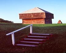 General view of Fort Edward showing the blockhouse and cairn in the background, emphasizing the cultural landscape of Fort Edward, 1983.; Parks Canada Agency / Agence Parcs Canada, F. Cattroll, 1983.