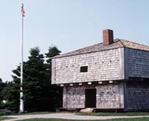 General view of the St. Andrews Blockhouse, showing the symmetrical articulation with a central door and regular window openings, 1982.; Parks Canada Agency/Agence Parcs Canada, F. Cattroll, 1982.