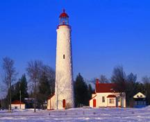 Panoramic view of the Keeper's House and Lighttower emphasizing its scale, design and materials, which are compatible with its surrounding building at Point Clark Lighthouse National Historic Site of Canada, 1995.; Parks Canada Agency / Agence Parcs Canada, J. Butterill, 1995.