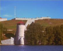 General view of the Fort Henry fortifications showing the inter-relationship of the glacis with natural features surrounding the site (its profile and the need for a retaining wall on the north and along the shore of Deadman's Bay).; Parks Canada Agency/Agence Parcs Canada, n.d.