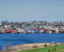 Panoramic view of Old Town Lunenburg Historic District showing the unity and cohesiveness created by the predominance of wood construction and exterior finishes among all building types and styles, 1993.; Parks Canada Agency/Agence Parcs Canada, 1993.