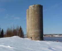 Situated near the office, these silos were built in 1932 to load Hillsborough's unusally pure and white rock gypsum into ocean going ships on the Petitcodiac water front.; Village of Hillaborough