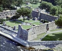 Aerial view of Fort Chambly showing the central courtyard surrounded on all four sides by stone buildings. 1965.; Parks Canada Agency / Agence Parcs Canada, 1965.