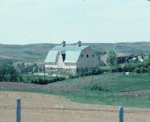 Distant view of Torkelson Farm, looking north west, 1997.; Government of Saskatchewan, Frank Korvemaker, 1997.