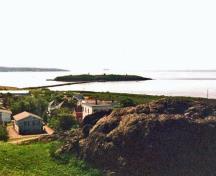 General view of Partridge Island Quarantine Station, showing the isolated location of Partridge Island at the mouth of Saint John Harbour.; Parks Canada Agency / Agence Parcs Canada, 2003.