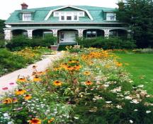 View of front of Jesse Ashbridge House and gardens, 1990s; OHT