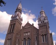The two tall asymmetrical spires of St. Brigid's Church.; RHI2, 2009
