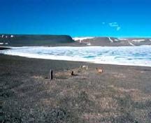 General view of the grave mounds and cairns at the Franklin wintering camp at Beechey Island Sites, 1977.; Parks Canada Agency / Agence Parcs Canada, D. Hardie, 1977.