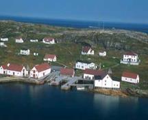 Aerial view of Battle Harbour Historic District, showing the spatial relationship of buildings, structures and open spaces, 2003.; Parks Canada Agency/Agence Parcs Canada, J. McQuarrie, 2003.