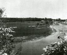 1960 photograph of Donaldson during the course of the excavations by James V. Wright. The photographer is looking east from the opposite bank of the river.; J.V. Wright and J.E. Anderson, “The Donaldson Site,” National Museum of Canada Bulletin 184, (1963))