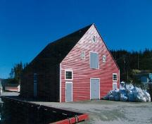 View of the left and front facades of Newman's Fish Store, Gaultois, NL.; © HFNL 2013 