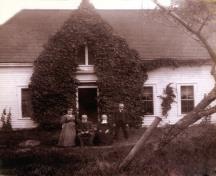 Historic image of the Stevens Homestead showing family members.; Stevens Family