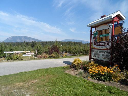View of entrance sign and orchards, 2012