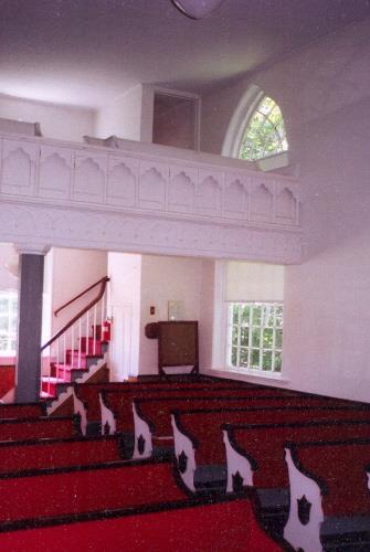 Showing interior with decorative balcony