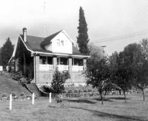 Front view of the Manager's House when still occupied as a residence, before the construction of the Haney By-pass, circa 1970; Maple Ridge Museum and Archives, P00461