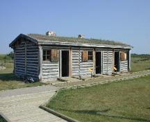 Vew northwest at reconstructed Men's House, 2004.; Government of Saskatchewan, Marvin Thomas, 2004.