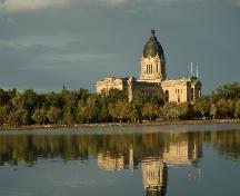 View of the Legislative Building and Grounds from across the lake which highlights the prominence of the dome on the local skyline; Government of Saskatchewan, Calvin Fehr, 2004.