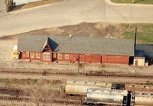 Aerial view of the Canadian Pacific Heritage Railway Station, showing its simple, domestic design, with features typical of QMO&O stations.; Parks Canada Agency/Agence Parcs Canada