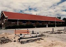 View of the Drill Hall, showing the the building’s brick wall exterior, 1986.; Gendarmerie royale du Canada | Royal Canadian Mounted Police, 1986.