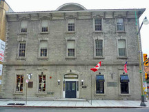 General view of the main facade of the Former Geological Survey of Canada Building emphasizing the simple Italianate detailing, including bracketed eaves, and cornices, 2011.; Parks Canada | Parcs Canada, M. Therrien, 2011.