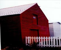Exterior photo of Grant's Stage, Trinity, Trinity Bay, NL.  Photo showing water-facing side of building.; HFNL 2005