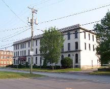364 Argyle Street (former Palmer-McLellan Factory) western side view of building with former Hartt Boot and Shoe Factory in the background; City of Fredericton
