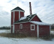 View of pump house portion, showing pulley system extending from the roof, 2003.; Government of Saskatchewan, Jennifer Bisson, 2003.