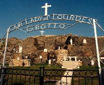 Front view of Our Lady of Lourdes Grotto, Flatrock, showing entry gate and Grotto features including statues, altar and Cruxifix.; Photo by Gerry Boland.  Courtesy Flatrock Grotto Committee.