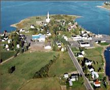 An aerial view of St. Andrew's St. Andrew's United Church and a section of the Village of Rexton.; Village of Rexton
