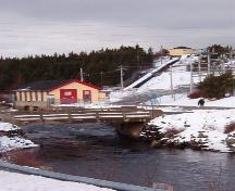 Exterior view of power generating plant, river, flume and substation, Port Union, NL. Taken January, 2006.; HFNL/ Lara Maynard 2006.