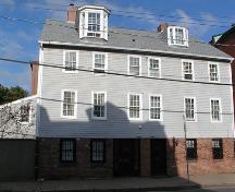 Alex Mclean House, large Scottish dormer on south half, small Scottish dormer on north half, symmetrical facade, six over six windows, brick and wood construction, Halifax, Nova Scotia, 2005.; Heritage Division, NS Dept. of Tourism, Culture and Heritage, 2005.