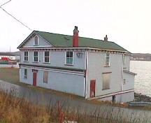 Exterior photo of Hodge Brother's Premises, Twillingate prior to restoration.  ; HFNL 1997