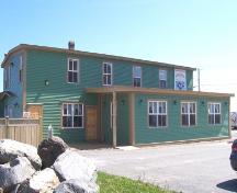 Southeast facing view of the front facade, Bernard Kavanagh Premises, Ferryland, NL. Photo taken May 2006. ; HFNL/Andrea O'Brien 2006
