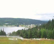 View looking west from Immaculate Conception Cemetery, Cape Broyle, NL, showing Fairy Pond in the background. Photo taken July 2006.; HFNL/Andrea O'Brien 2006