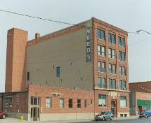 View of front and side elevations from west, showing original signage, 2005.; Ross Herrington, 2005
