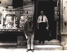 Georges Léger outside of his pharmacy.; CÉA