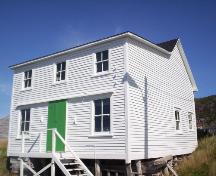 View of front facade and right gable end of the John Quinton Limited Shop, Red Cliffe, NL, showing the roofline of the original structure and the storefront addition, taken September 24, 2006; HFNL/Dale Jarvis 2006