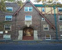 Main entrance of Kenora Apartments on 14th Avenue showing half-timbering and imitation Medieval thatching, 2005.; Ross Herrington, 2005