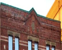 Showing detail of decorative frieze with floret medallion; City of Charlottetown, Natalie Munn, 2006
