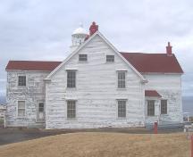 Southwestern facade of Long Point Light Station Dwelling, Crow Head, NL. Photo taken April 2006. ; HFNL/Andrea O'Brien 2006