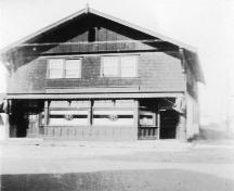 Exterior view of the Bank of Montreal Building during its time as a retail store for the B.C. Liquor Control Board.; Gwen Szychter, no date
