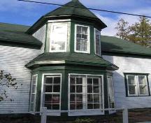 Photo of the "bump" entrance to the de Olloqui House.; Village of Rexton