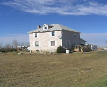 Looking northwest at the house's primary facade (facade facing the road), 2005.; Government of Saskatchewan, Marvin Thomas, 2005.