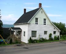View facing northeast, showing front and side of house, as well as the steep gabled roof with change of pitch over lean-to.; Restigouche Regional Museum, Dalhousie