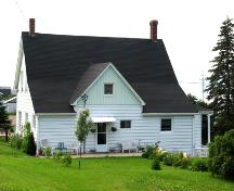 View facing west, showing lean-to roof and cross gable remnant from original attached storage buildings.; Restigouche Regional Museum, Dalhousie